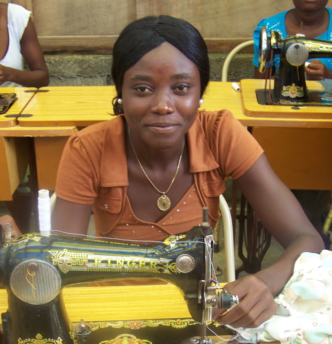 young woman in orange learning to sew